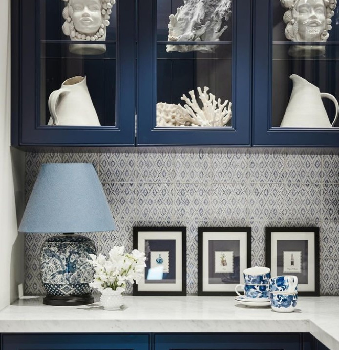 Navy blue kitchen cabinets in a pantry with beautiful patterned tile on backsplash and an under the sea motif - Maine House Interiors (Photo: @lisacohenphotography). #bluekitchencabinets #navybluekitchen