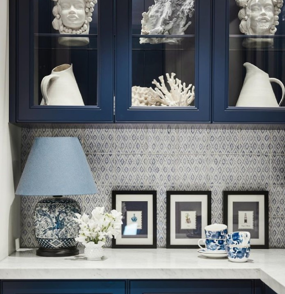 Navy blue kitchen cabinets in a pantry with beautiful patterned tile on backsplash and an under the sea motif - Maine House Interiors (Photo: @lisacohenphotography). 