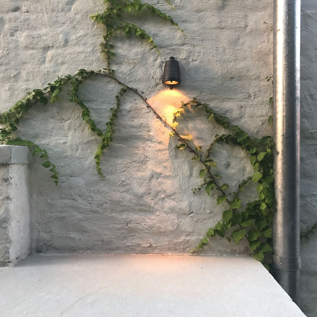 Murphy Mears designed Houston home's outdoor kitchen with limestone slabs.