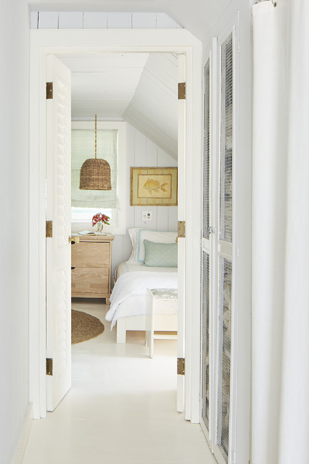 Tranquil muted blue bedroom in Bahamas with design by Trish Becker for Coastal Living - photo by Annie Schlechter. #coastalbedroom #paleblue