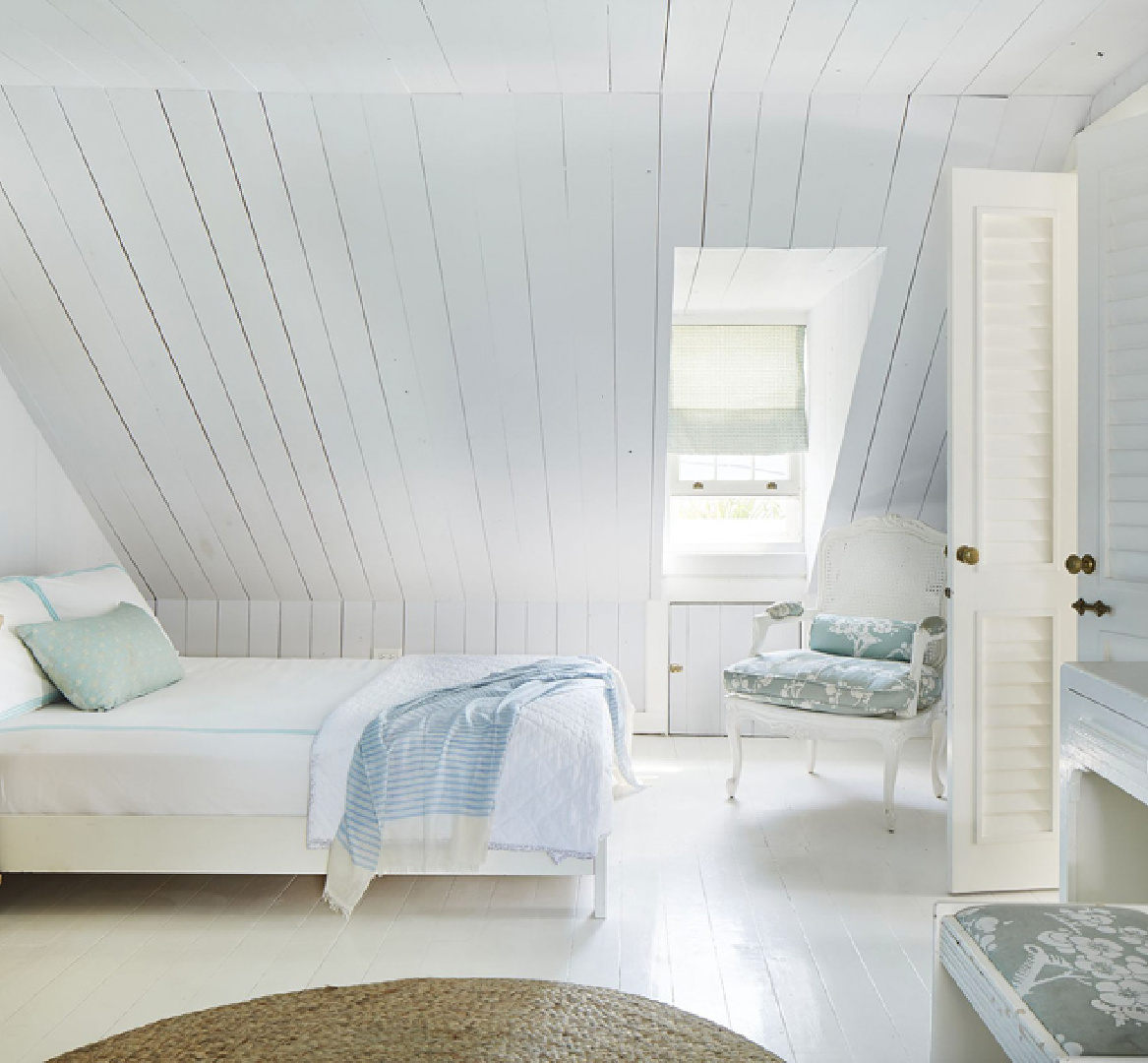 Tranquil muted blue bedroom in Bahamas with design by Trish Becker for Coastal Living - photo by Annie Schlechter. #coastalbedroom #paleblue