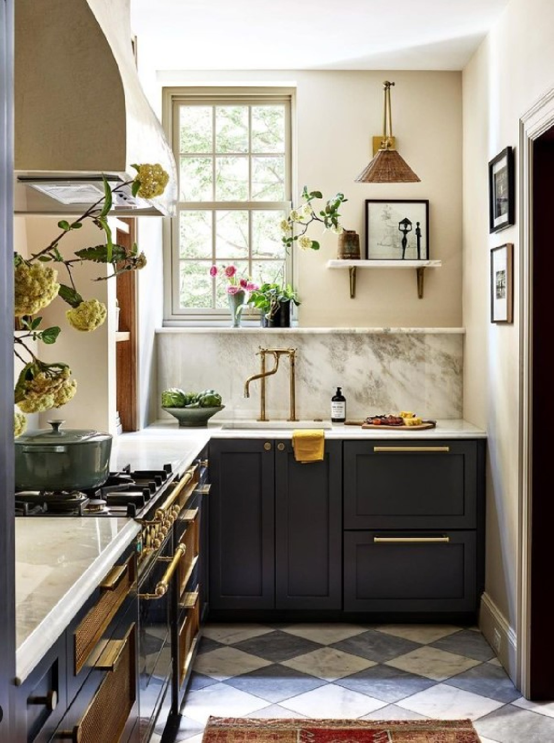 F&B Dimity on walls. Zoe Feldman Design - luxurious European inspired kitchen with grey marble checkered floor, Hallman range, honed marble counters, and Farrow & Ball Railings painted cabinets. #bespokekitchens