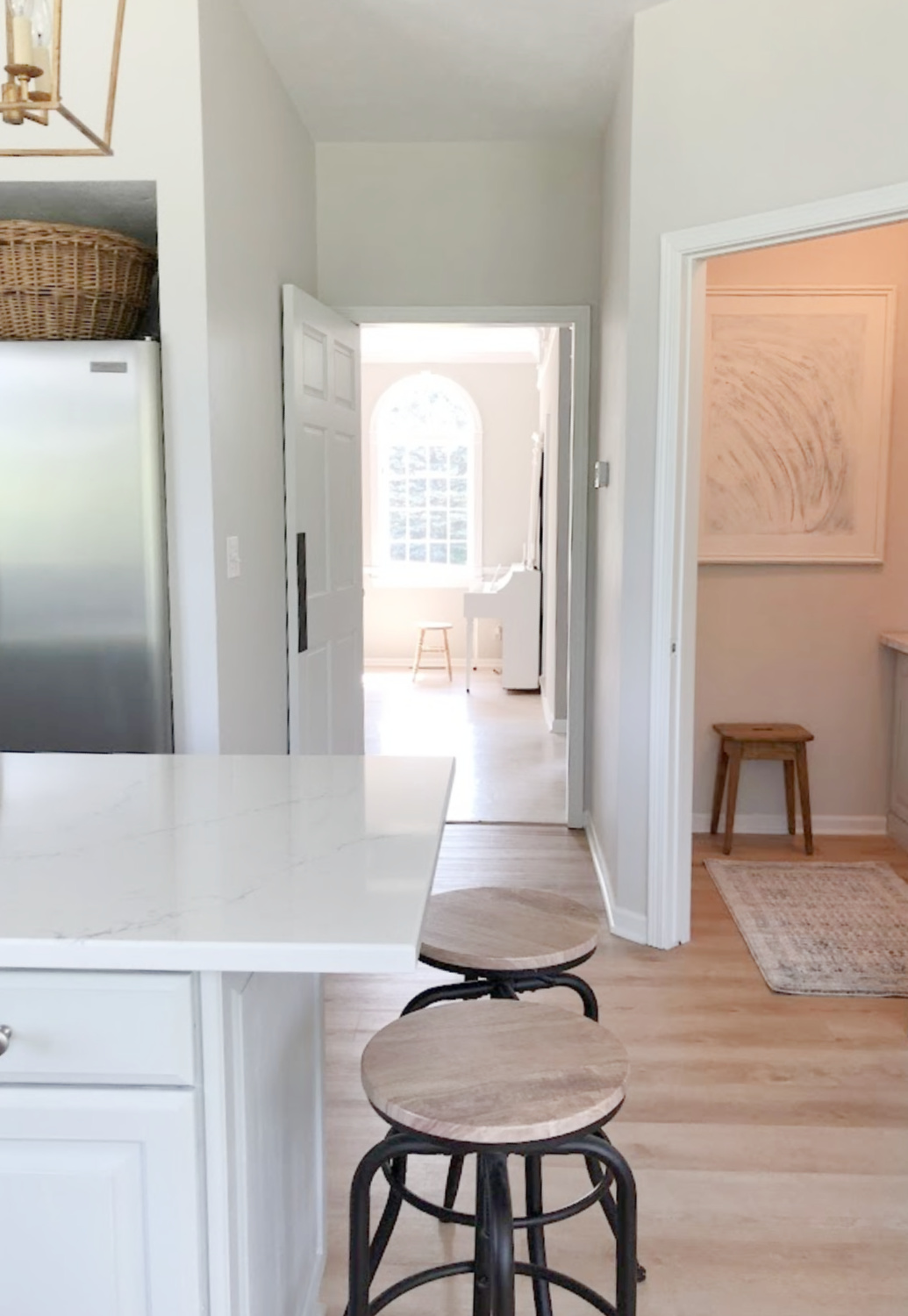 View toward dining room and pantry from kitchen with Viatera Muse quartz - Hello Lovely Studio. #viateramuse