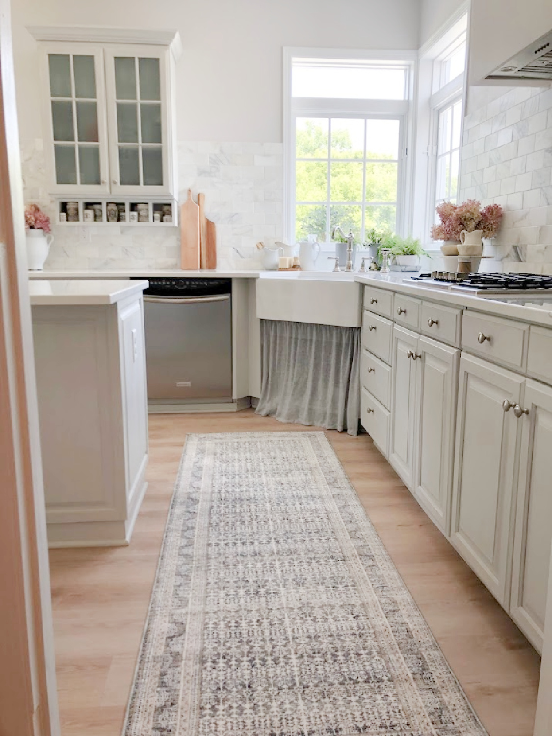 Amber Lewis x Loloi runner rug in my modern French kitchen with Muse quartz (Viatera) - Hello Lovely Studio. #modernfrench #greykitchens #viateramuse