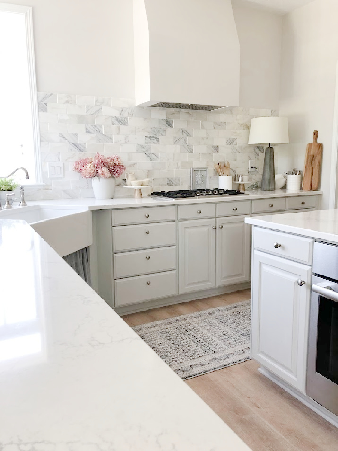 Amber Lewis x Loloi runner rug in my modern French kitchen with Muse quartz (Viatera) - Hello Lovely Studio. #modernfrench #greykitchens #viateramuse