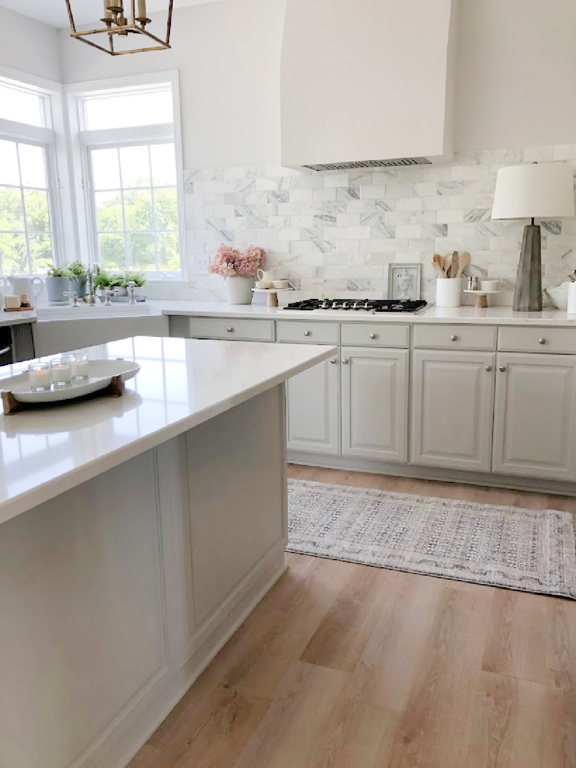 Amber Lewis x Loloi runner rug in my modern French kitchen with Muse quartz (Viatera) - Hello Lovely Studio. #modernfrench #greykitchens #viateramuse