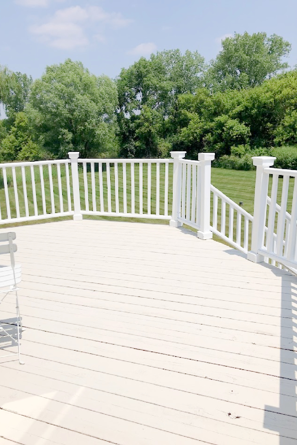 Deck with stone/grey and white railing at the Georgian - Hello Lovely Studio.