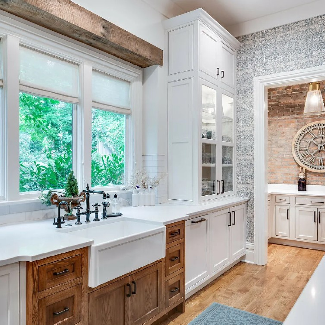 Stunning kitchen with two tone cabinetry, farm sink, and traditional style within a historic 1870 home (Murfreesboro Rd) in Franklin, TN. #farmhousekitchens