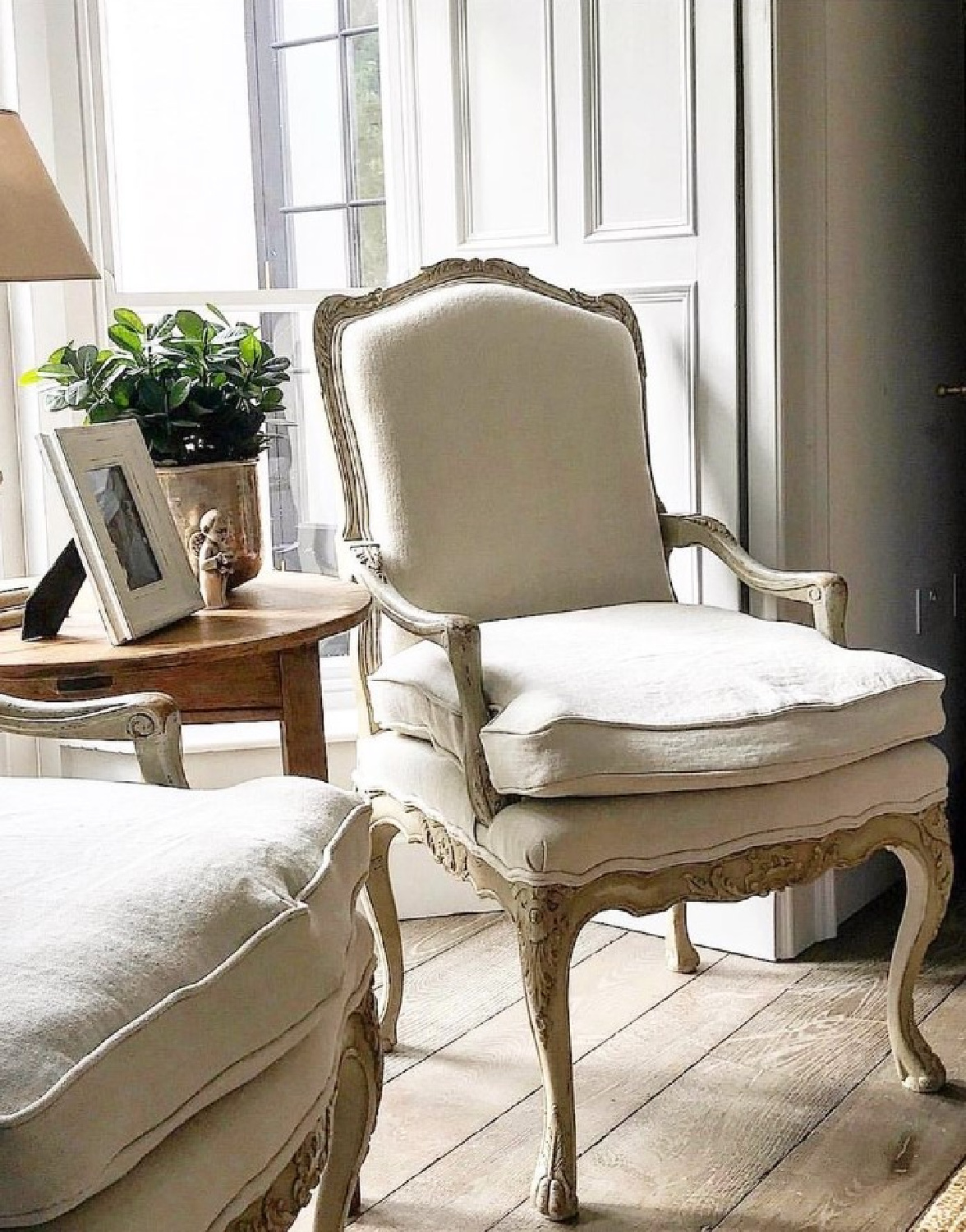 @minniepetersdesign - Belgian linen on elegant chairs in a paneled European country space. #belgianlinen