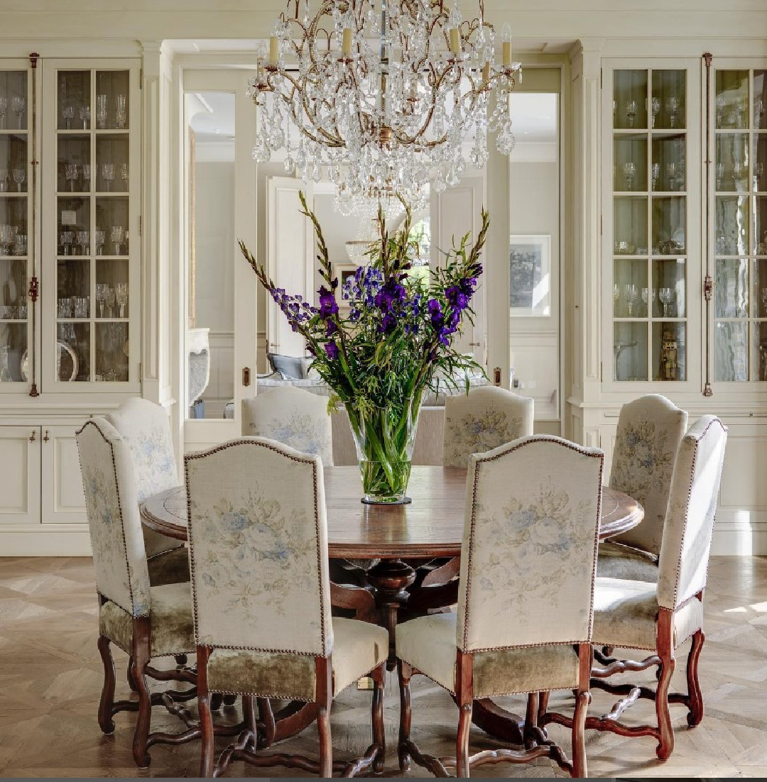 @minniepetersdesign - Elegant European country dining room with round table and upholstered chairs. #belgianinteriors
