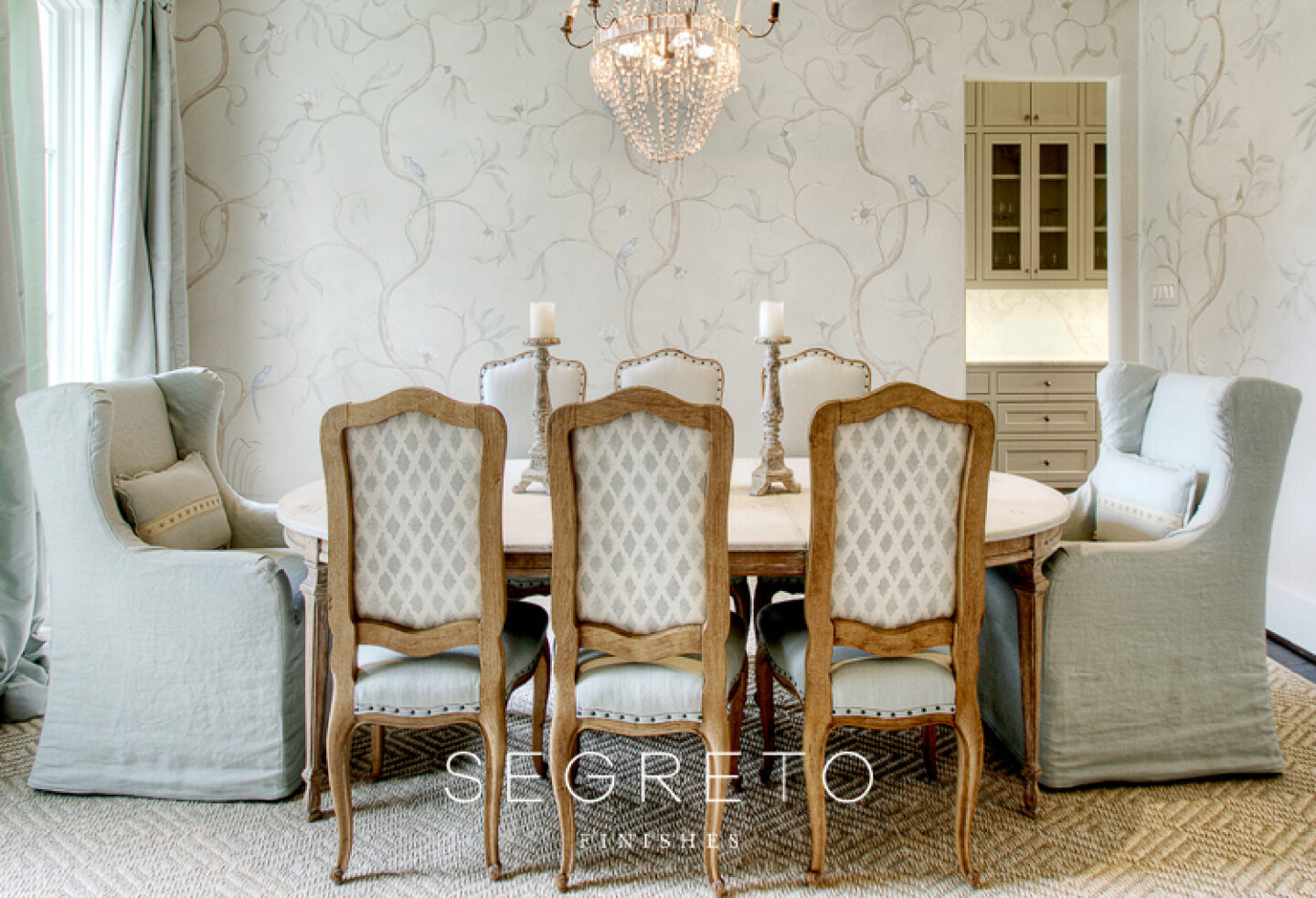 Lovely French country dining room with delicate, understated mural painted by Segreto Finishes.