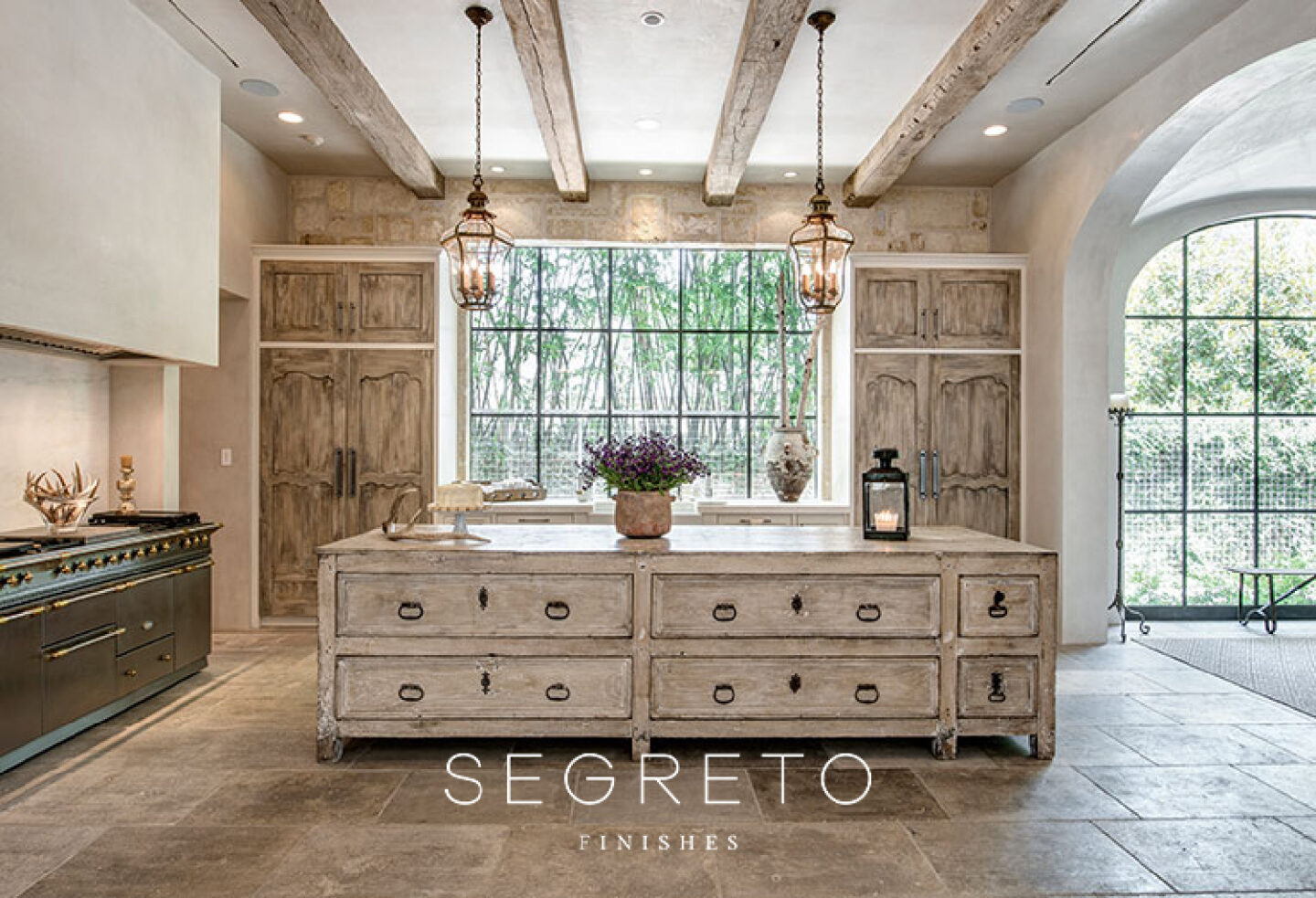 Old World style French country kitchen with antiques, reclaimed materials, and finish work by Segreto Finishes.