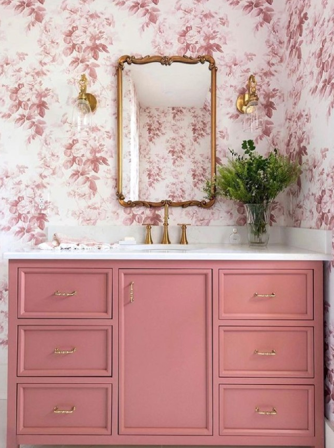 @homesbygardengate -Rose toile wallpaper in a beautiful bath with rose painted vanity and gold toned mirror. #bathroomdesign #bathroomwallpaper