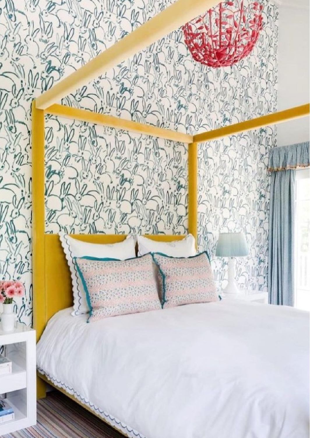 @honeycollinsinteriors - Blue bunny wallpapered bedroom with yellow canopy bed. #bedroomdesign #bedroomwallpaper