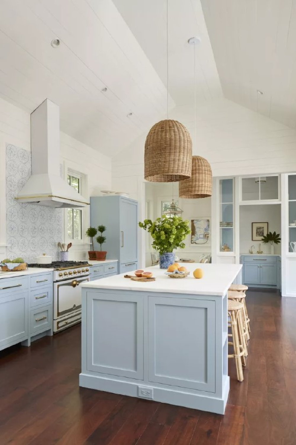 Farrow & Ball Parma Gray kitchen cabinets, La Cornue range, and Tabarka Studio tiled backsplash - Torrance Mitchell - Julia Berolzheimer's home in Southern Living (photo: Hector Manuel Sanchez). #farrowandballparmagray #bluekitchens #charlestonkitchens #traditionalstyle