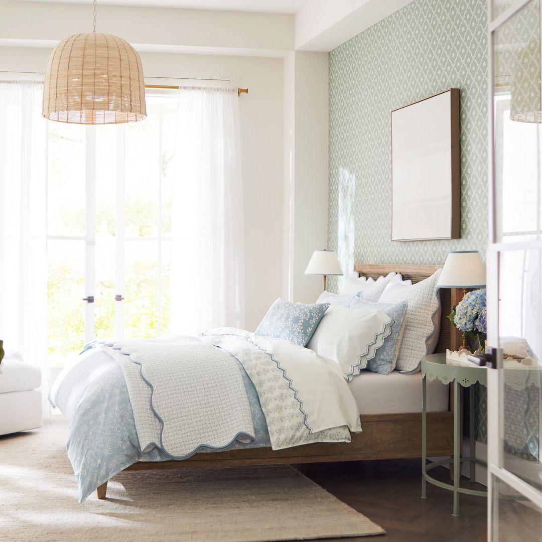 Julia Berolzheimer bedroom pieces from Pottery Barn including scalloped demilune Eloise etagere used as nightstand.