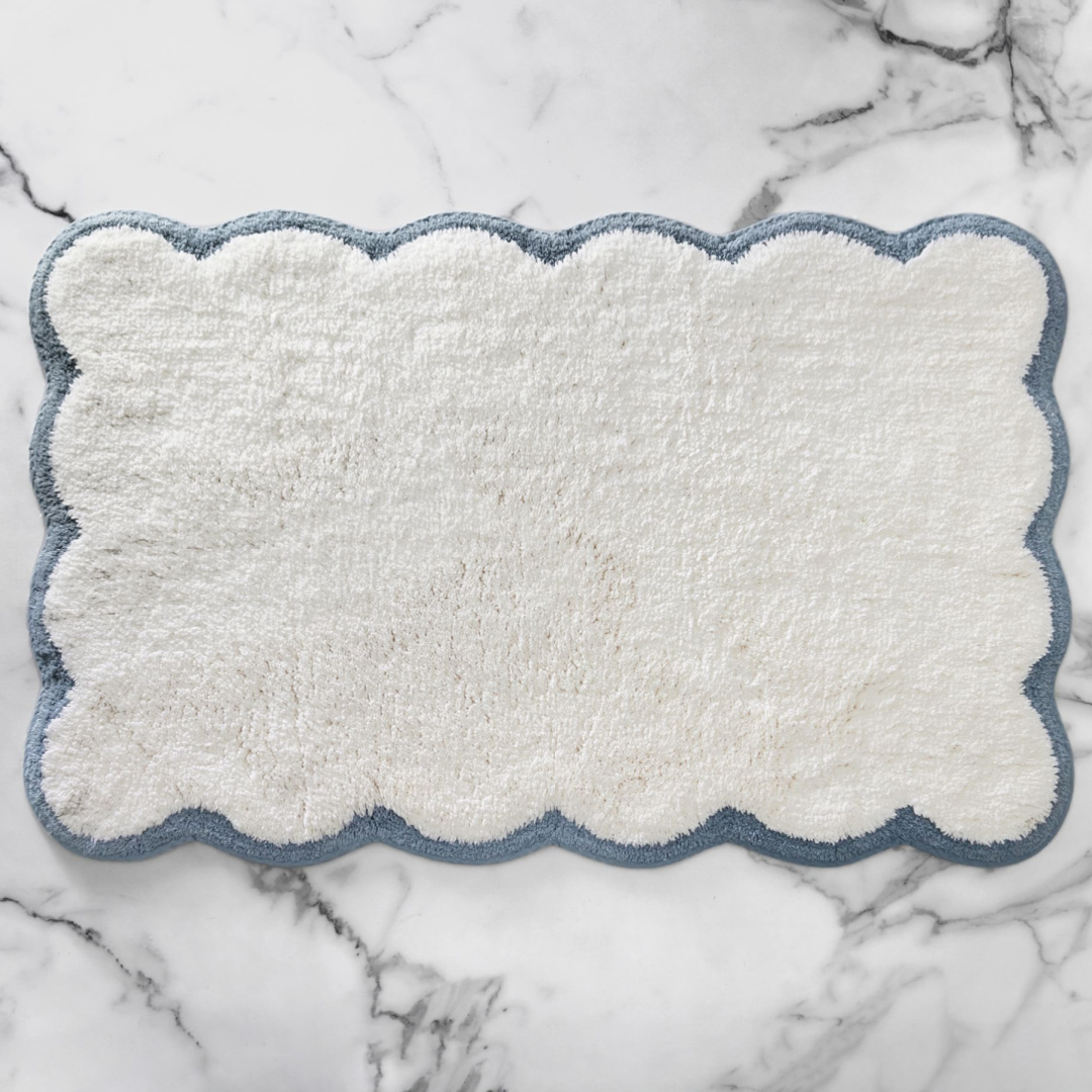 Julia Berolzheimer scalloped organic bath mat - Pottery Barn. #bathmats