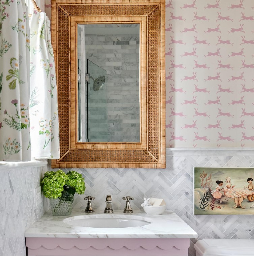Beautiful timeless bath with pink vanity and bunny wallpaper - M. E. Beck Design. #bathroomdesign #pinkinteriors