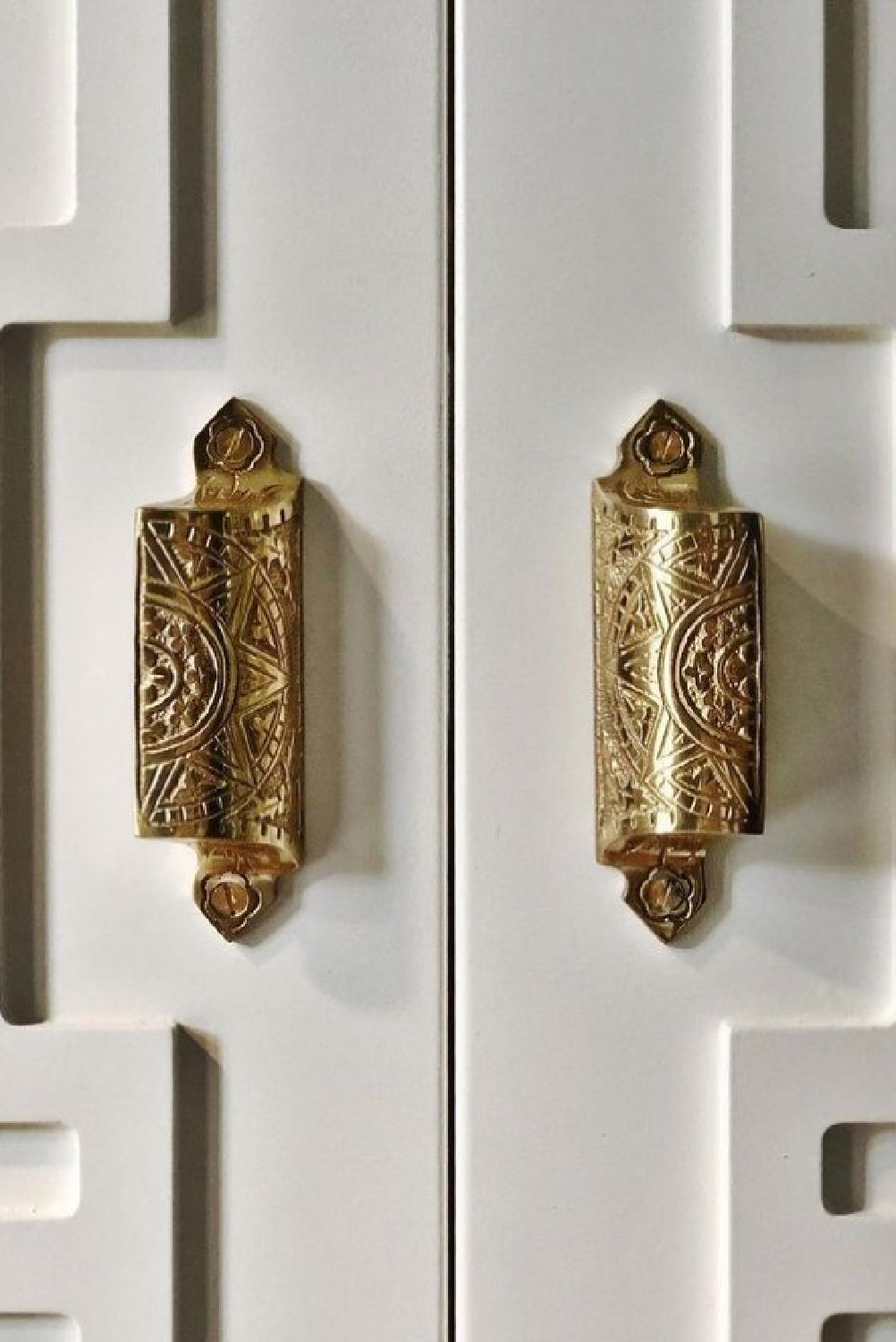 Brass hardware on custom doors in a renovated 1931 home - M. E. Beck Design.