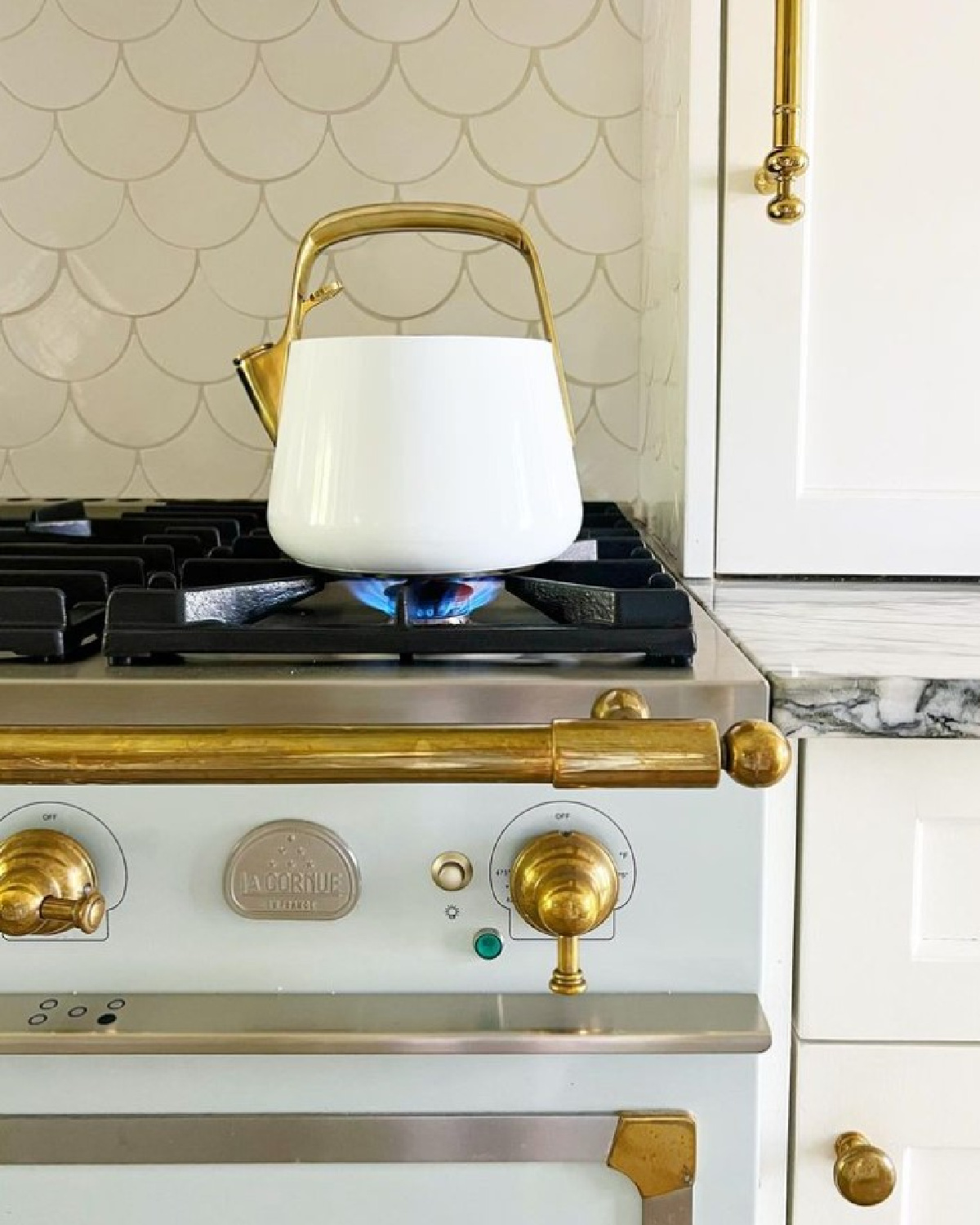 Detail of LaCornue range in timeless kitchen by Maria E. Beck Design.