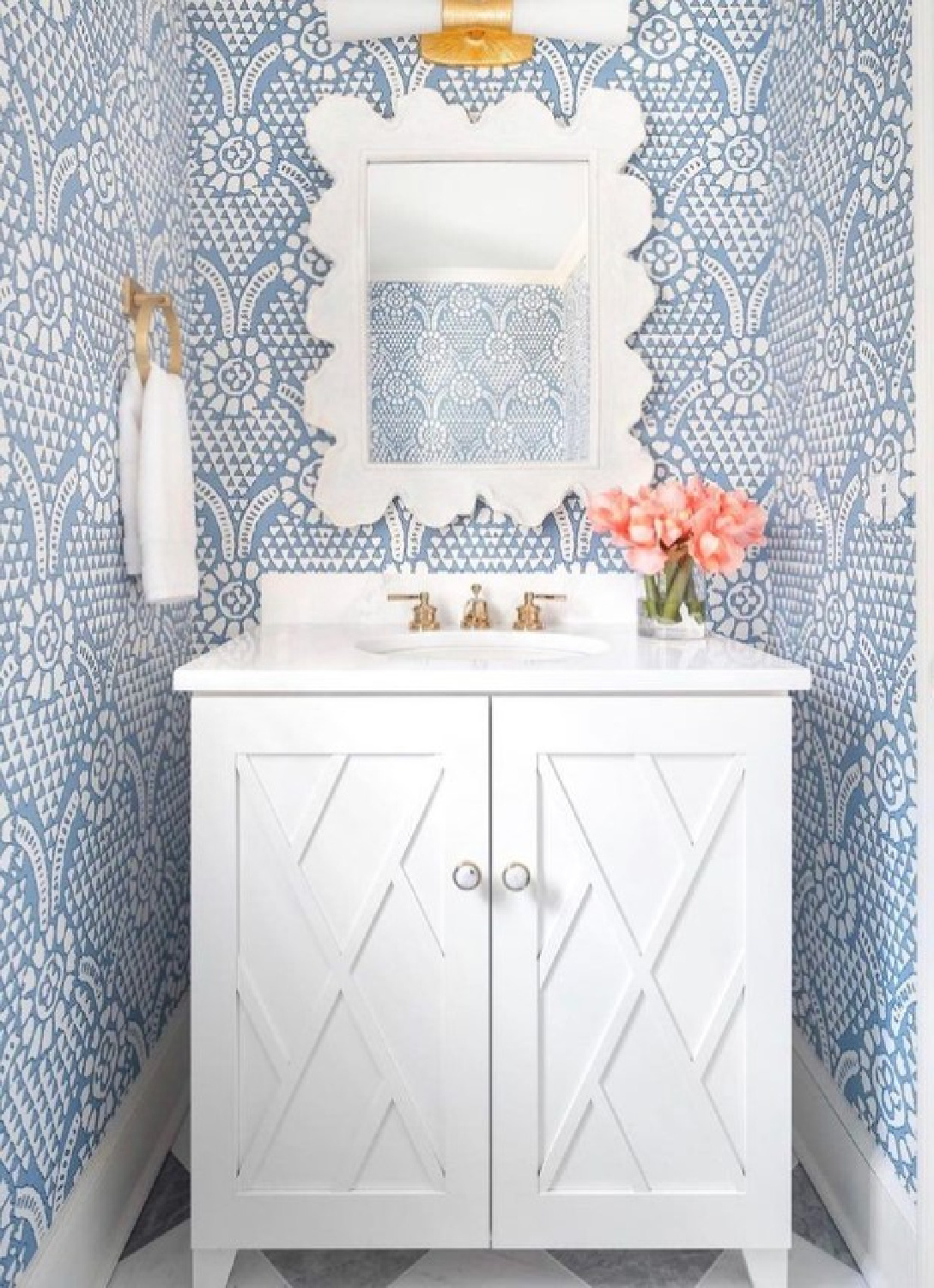 @mldesignkc - Beautiful blue wallpaper in a bath with scalloped mirror. #bathroomdesign #bathroomwallpaper