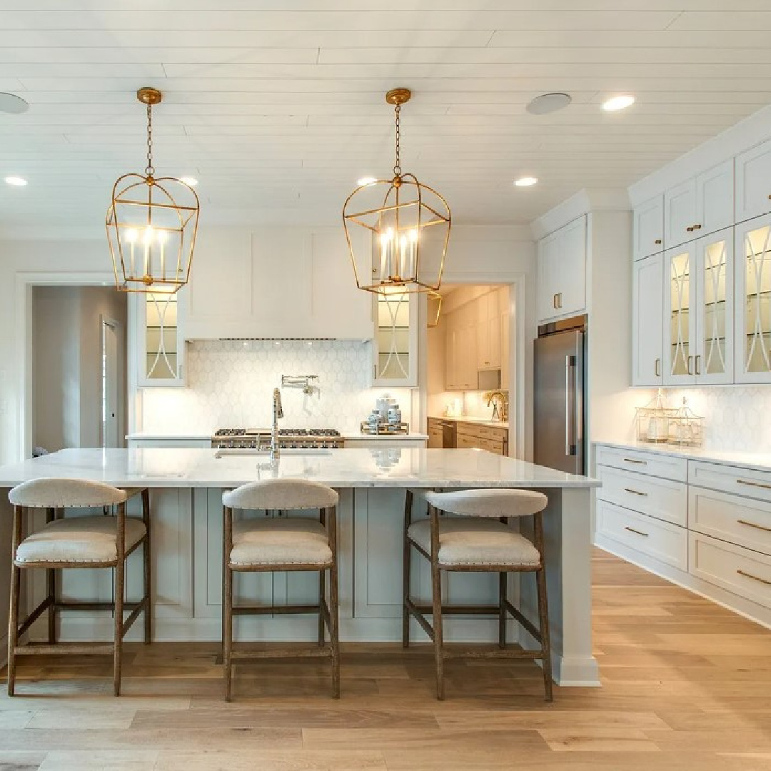 Classic and beautiful white kitchen with island and warm wood floors in a Sipple Home on Pasquo in Franklin, TN.