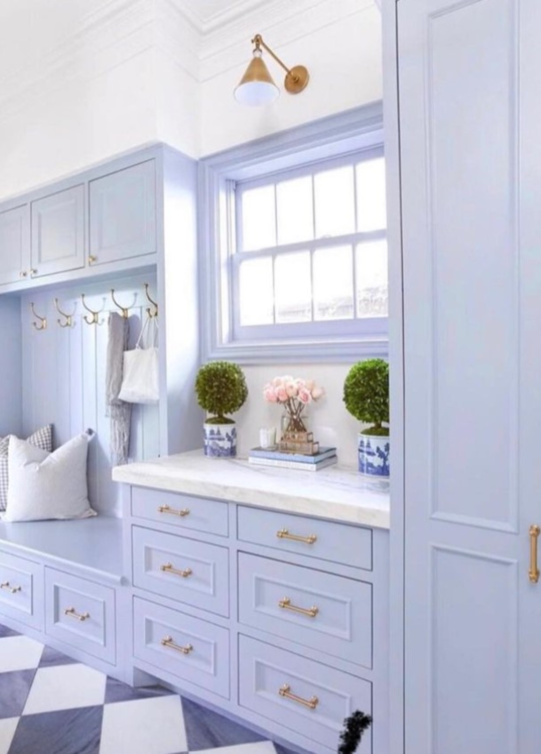 #caitlinwilsondesign - A periwinkle blue painted mudroom.