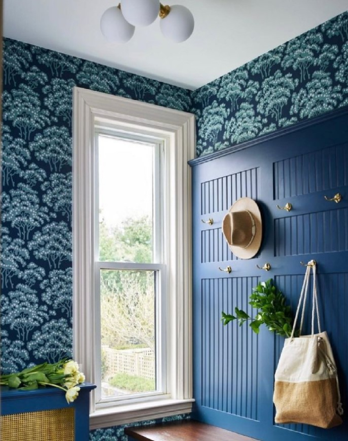 @sarahcoleinteriors - Bold blue Hornbeam wallpaper (Farrow & Ball) in a mudroom with bench. #mudrooms #bluewallpaper