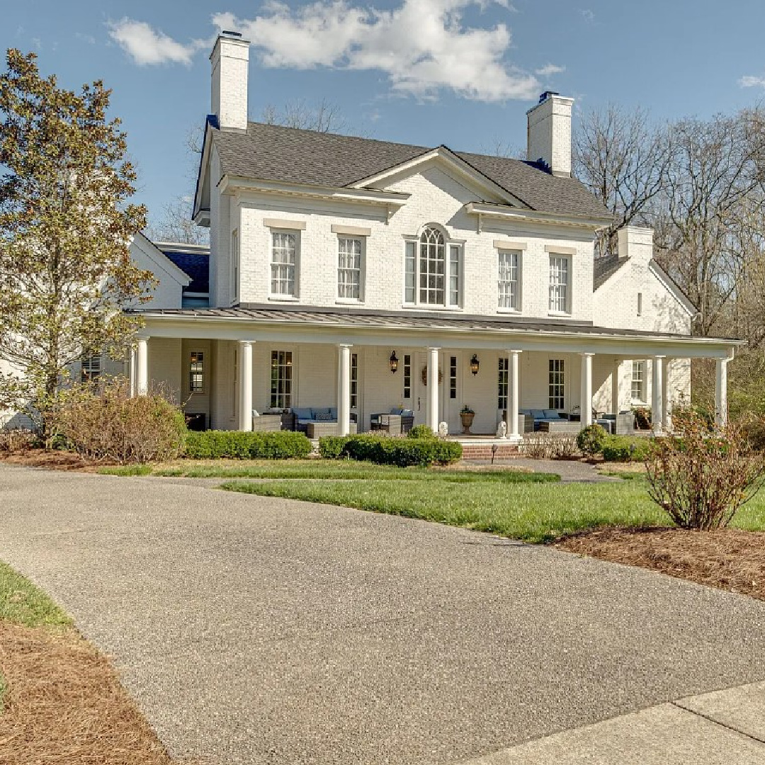 Beautiful white house exterior with wraparound front pourch - on Stableford in Franklin, TN. #frontporches #houseexteriors