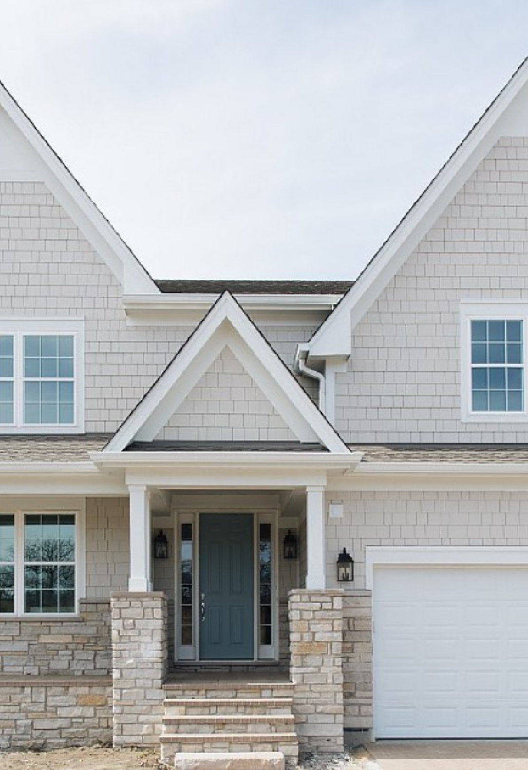 Benjamin Moore Cloudy Sky on front door of a beautiful shingle style home - @timbertrailshomes. #bmcloudysky