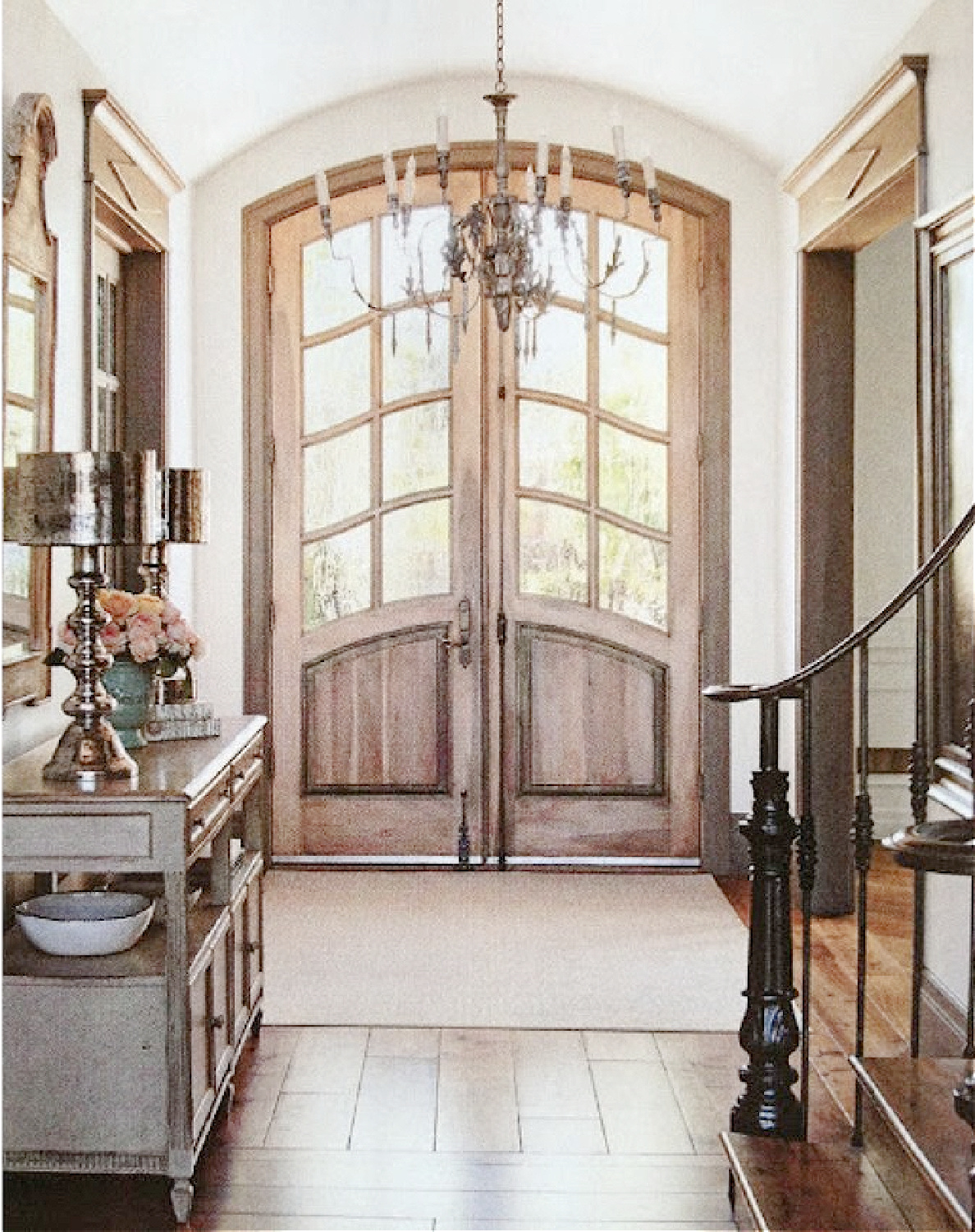 Arched double doors in French country entry of a home by Desiree Ashworth - styling by Bonnie Broten for COUNTRY FRENCH magazine. #archeddoors