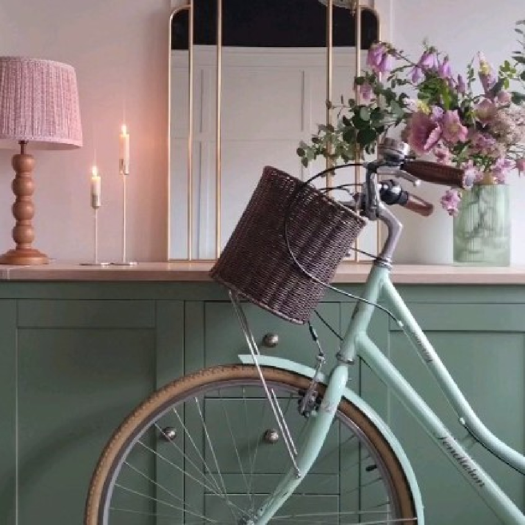 French country vignette with green cabinet and aqua bicycle - @elle_the_home_bird. #frenchcountry #englishcountry