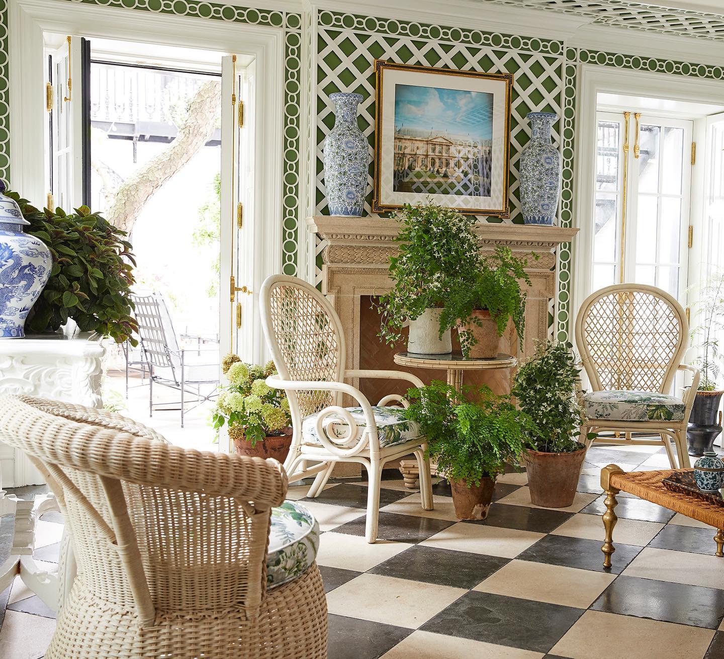 Summer Thornton's beautiful sun room with large scale scheckered floor, lattice, and breezy rattan furniture. #summerthornton #checkeredfloors