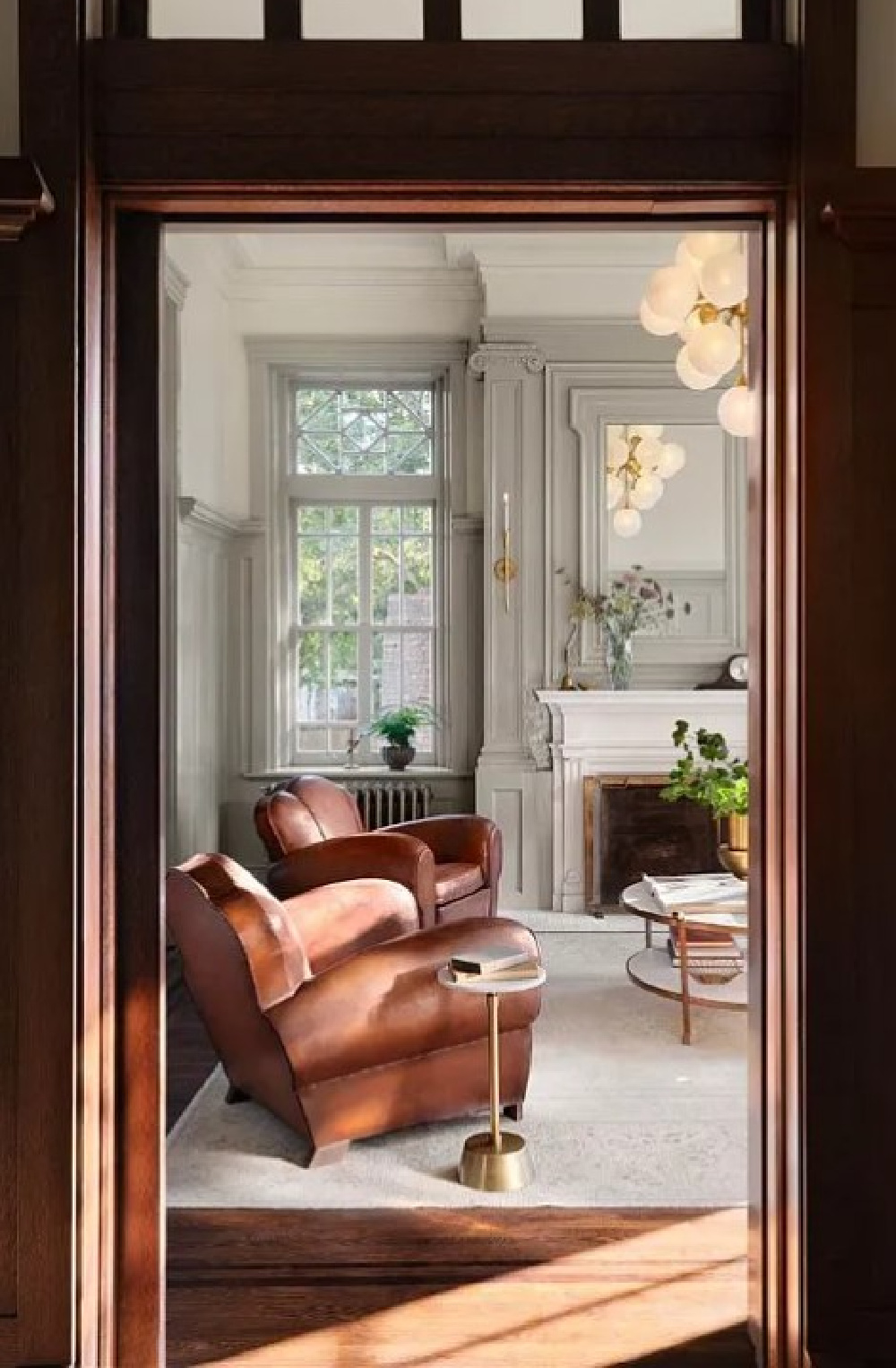 Drawing Room (a soft French Gray paint color by Kilz - Magnolia's Castle Collection by Joanna Gaines) on paneling in Fixer Upper The Castle (Waco, TX). #thecastle #fixerupperthecastle