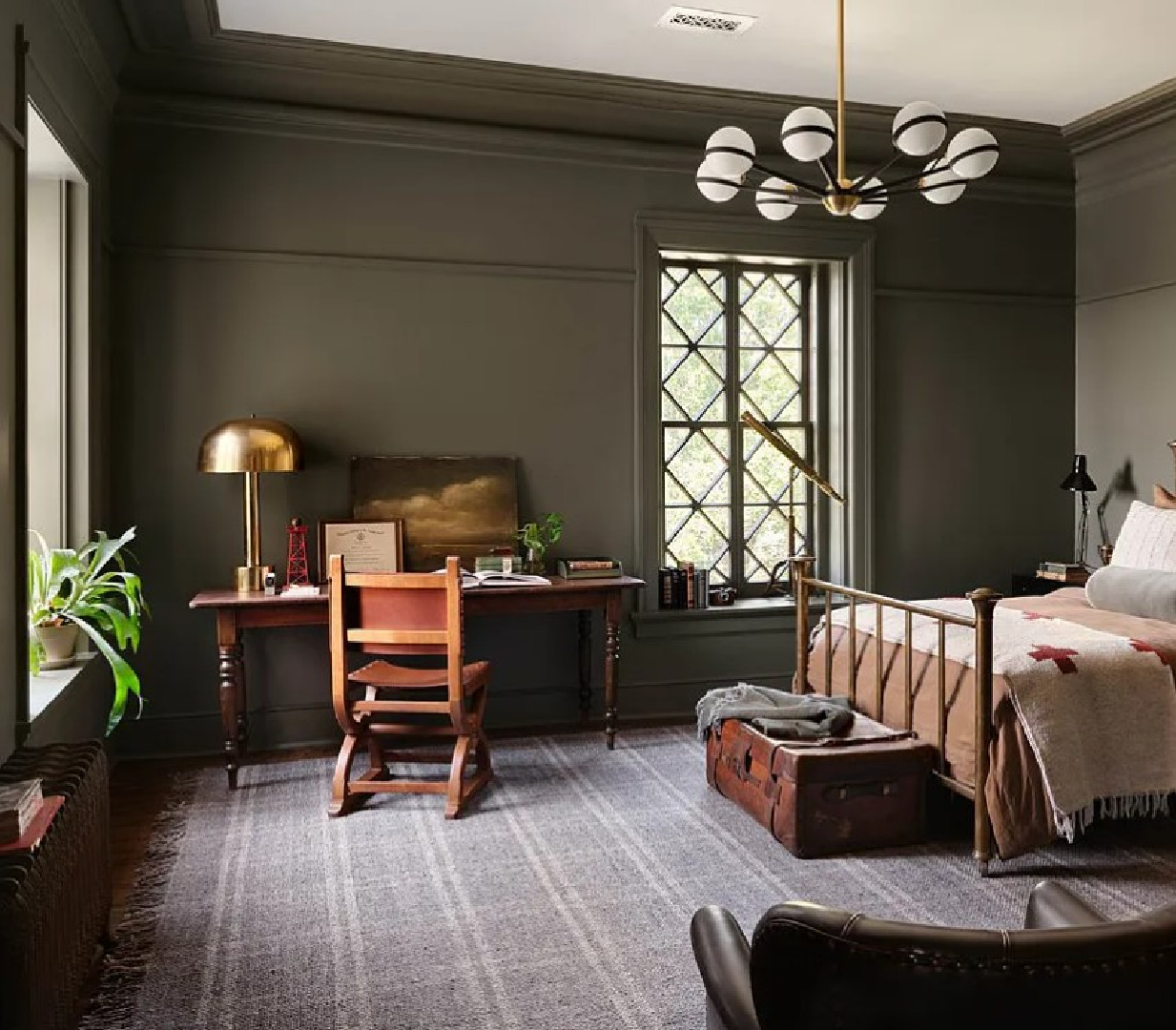 Estate (a deep sage green-gray by Kilz - Magnolia's Castle Collection by Joanna Gaines) on walls of handsome deep green bedroom in Fixer Upper The Castle (Waco, TX). #thecastle #fixerupperthecastle