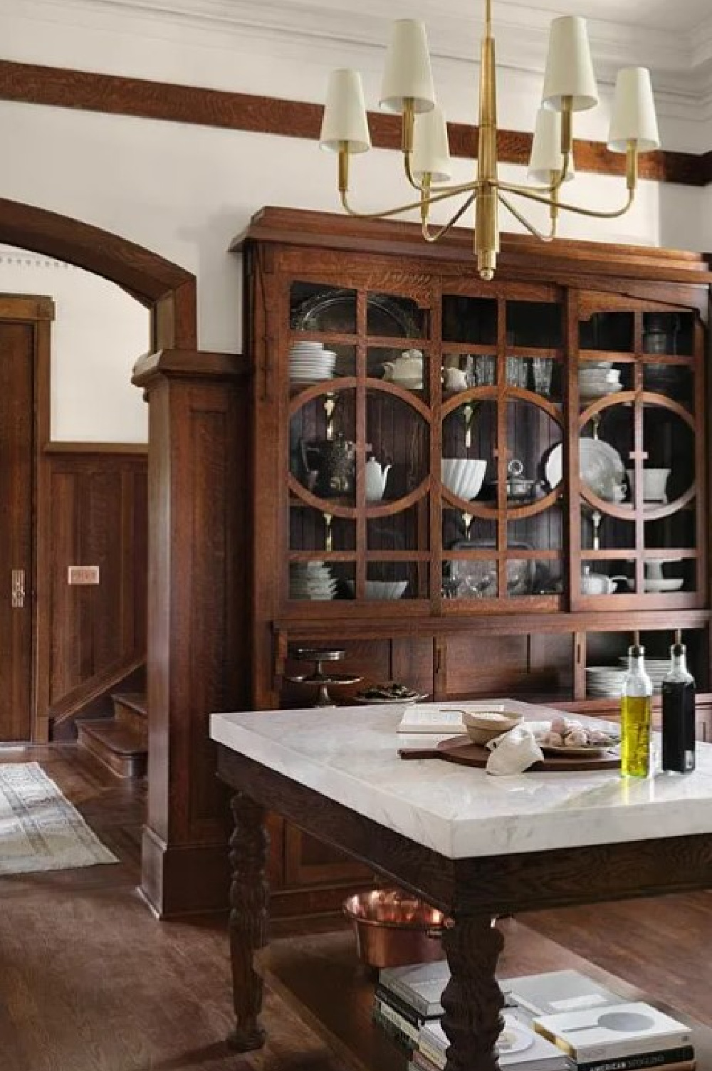 Beautiful kitchen with dark wood and white marble in Fixer Upper The Castle.