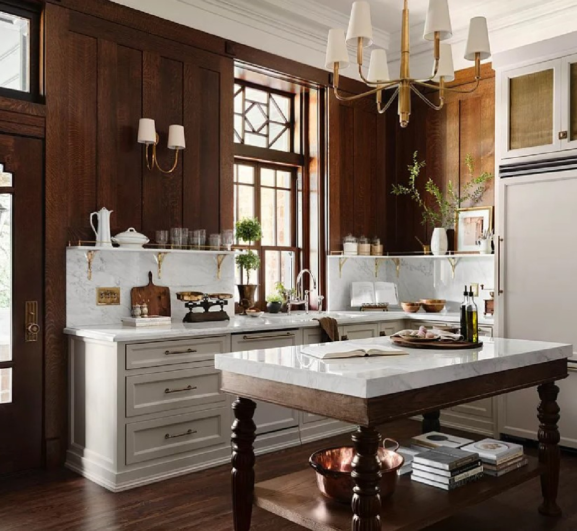 Beautiful kitchen with dark wood and white marble in Fixer Upper The Castle.