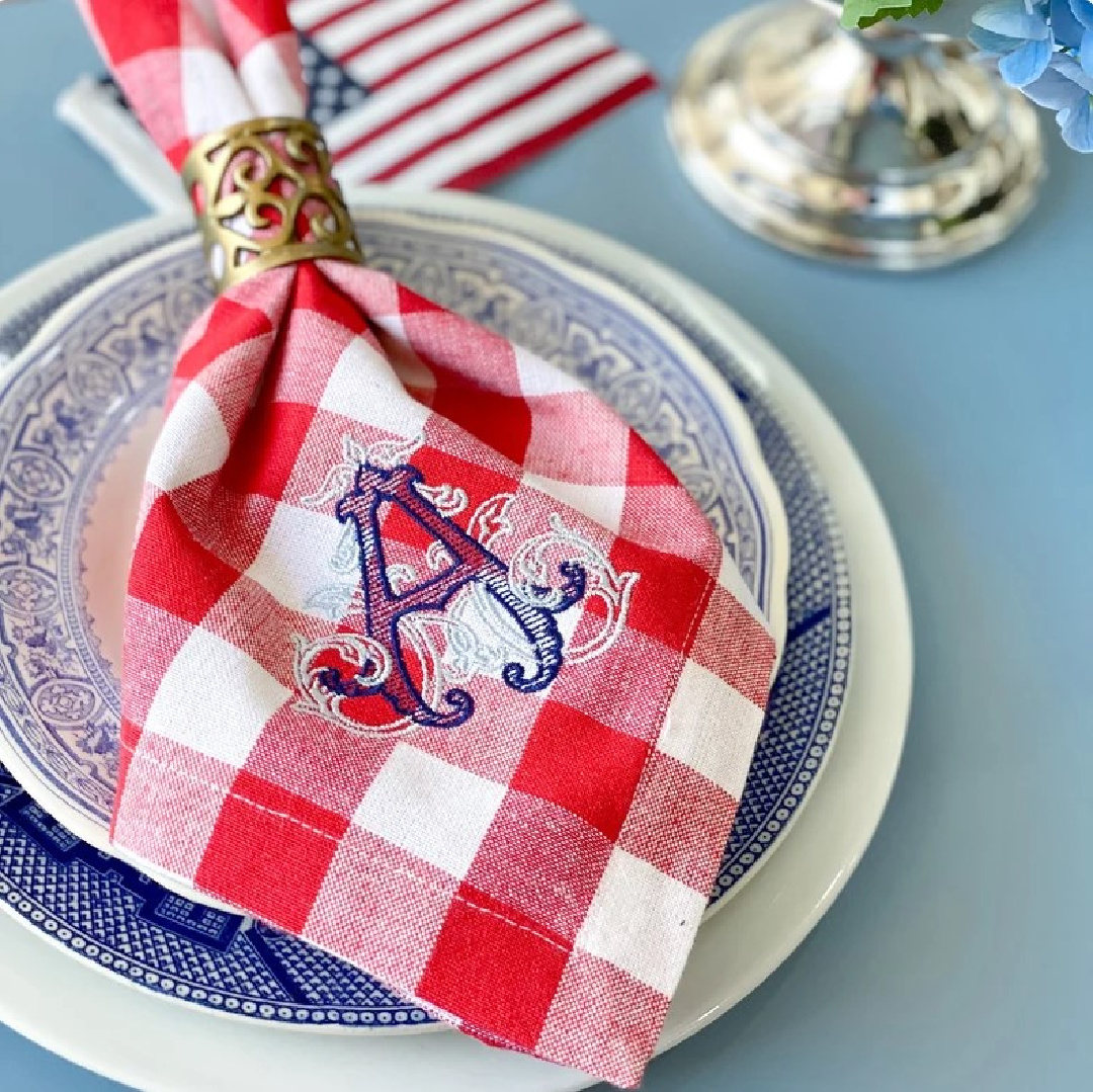 SBMonograms on Etsy - 4th of July monogrammed red check napkin on a beautiful blue plate. #4thofjulytablescape. #monogrammednapkins