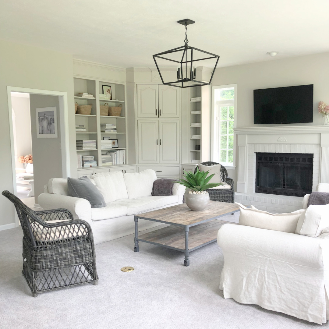 SW Agreeable Gray in tonal family room with built-ins and Belgian linen - Hello Lovely Studio. #swagreeablegray