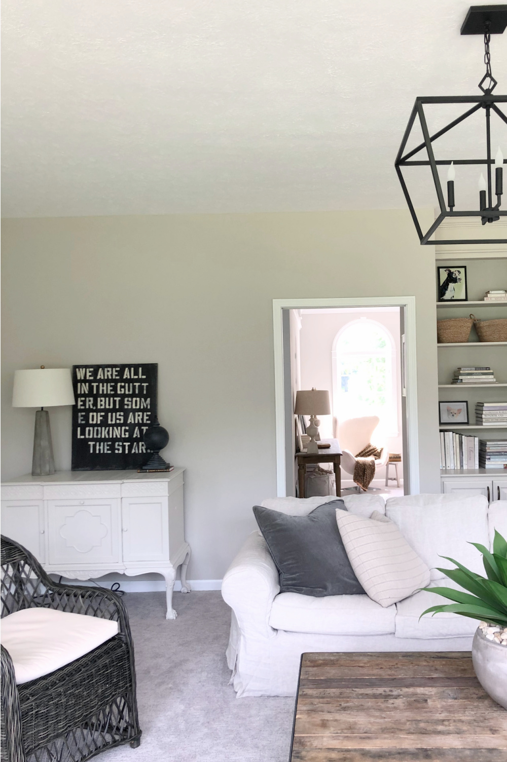 SW Agreeable Gray in tonal family room with built-ins and Belgian linen - Hello Lovely Studio. #swagreeablegray