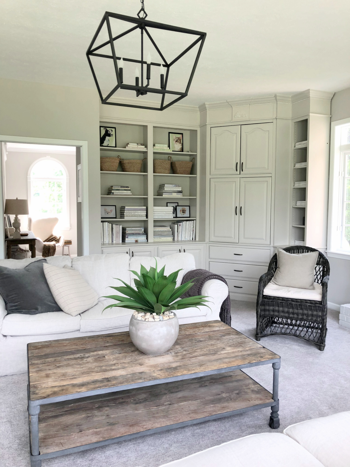 SW Agreeable Gray in tonal family room with built-ins and Belgian linen - Hello Lovely Studio. #swagreeablegray