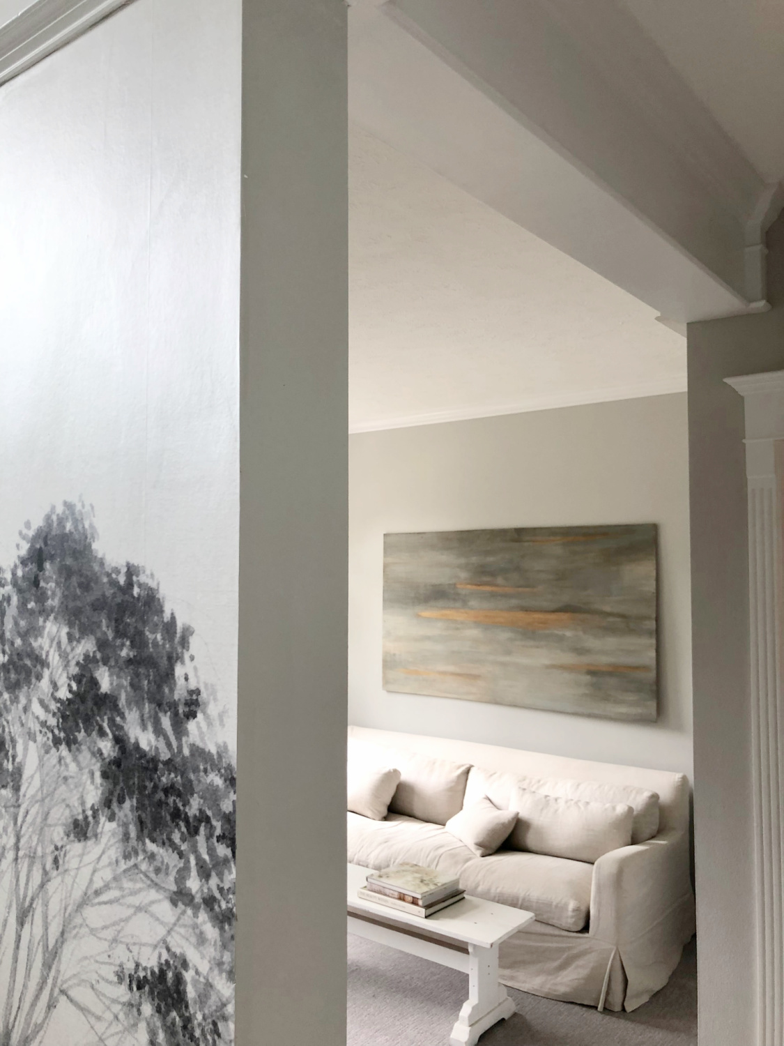 SW Repose Gray in living room with Belgian linen sofa, egg chair, and arched windows - Hello Lovely Studio. #reposegray #belgianstyle