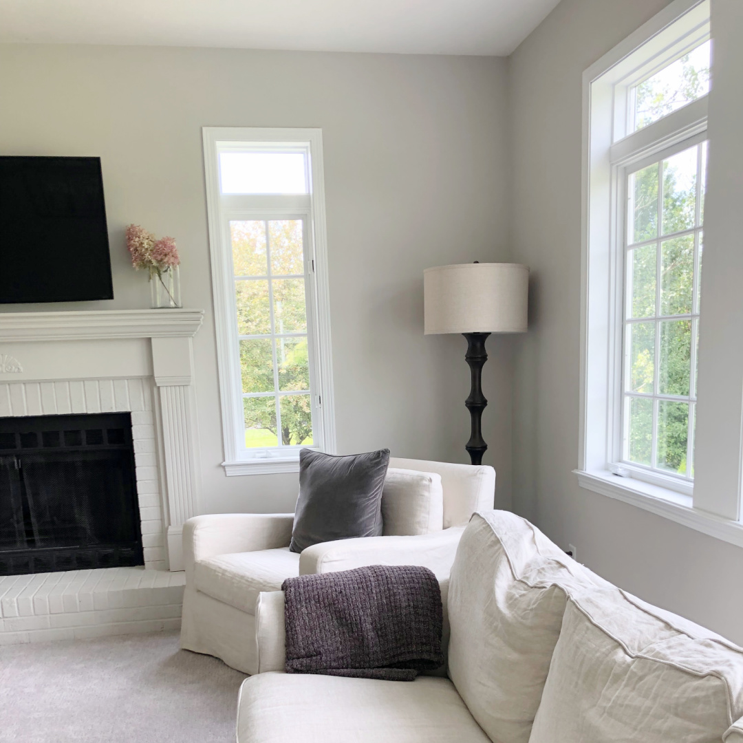 SW Agreeable Gray in tonal family room with built-ins and Belgian linen - Hello Lovely Studio. #swagreeablegray