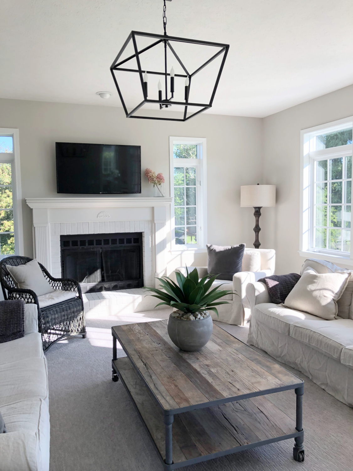 SW Agreeable Gray in tonal family room with built-ins and Belgian linen - Hello Lovely Studio. #swagreeablegray