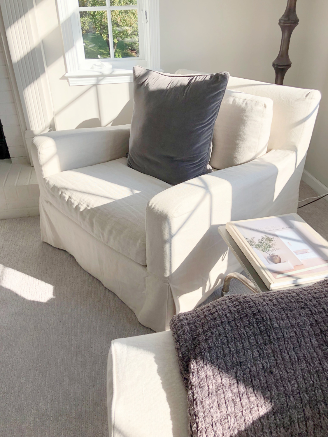 SW Agreeable Gray in tonal family room with built-ins and Belgian linen - Hello Lovely Studio. #swagreeablegray