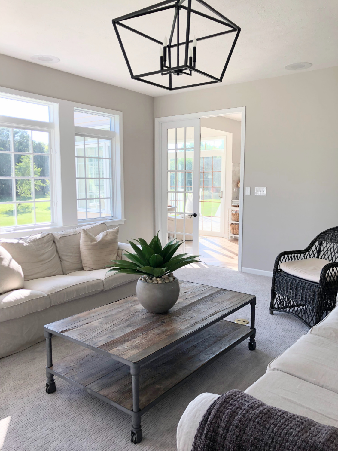 SW Agreeable Gray in tonal family room with built-ins and Belgian linen - Hello Lovely Studio. #swagreeablegray