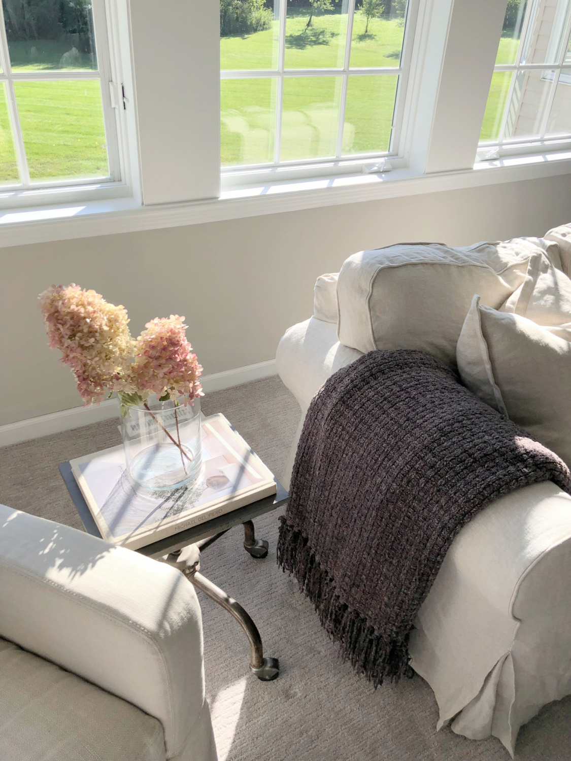 SW Agreeable Gray in tonal family room with built-ins and Belgian linen - Hello Lovely Studio. #swagreeablegray