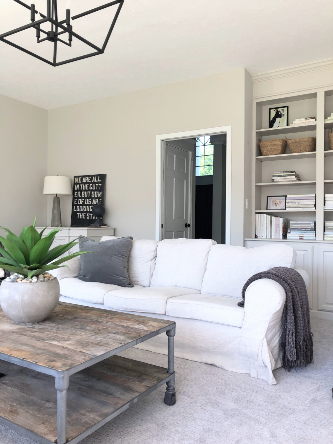 SW Agreeable Gray in tonal family room with built-ins and Belgian linen - Hello Lovely Studio. #swagreeablegray