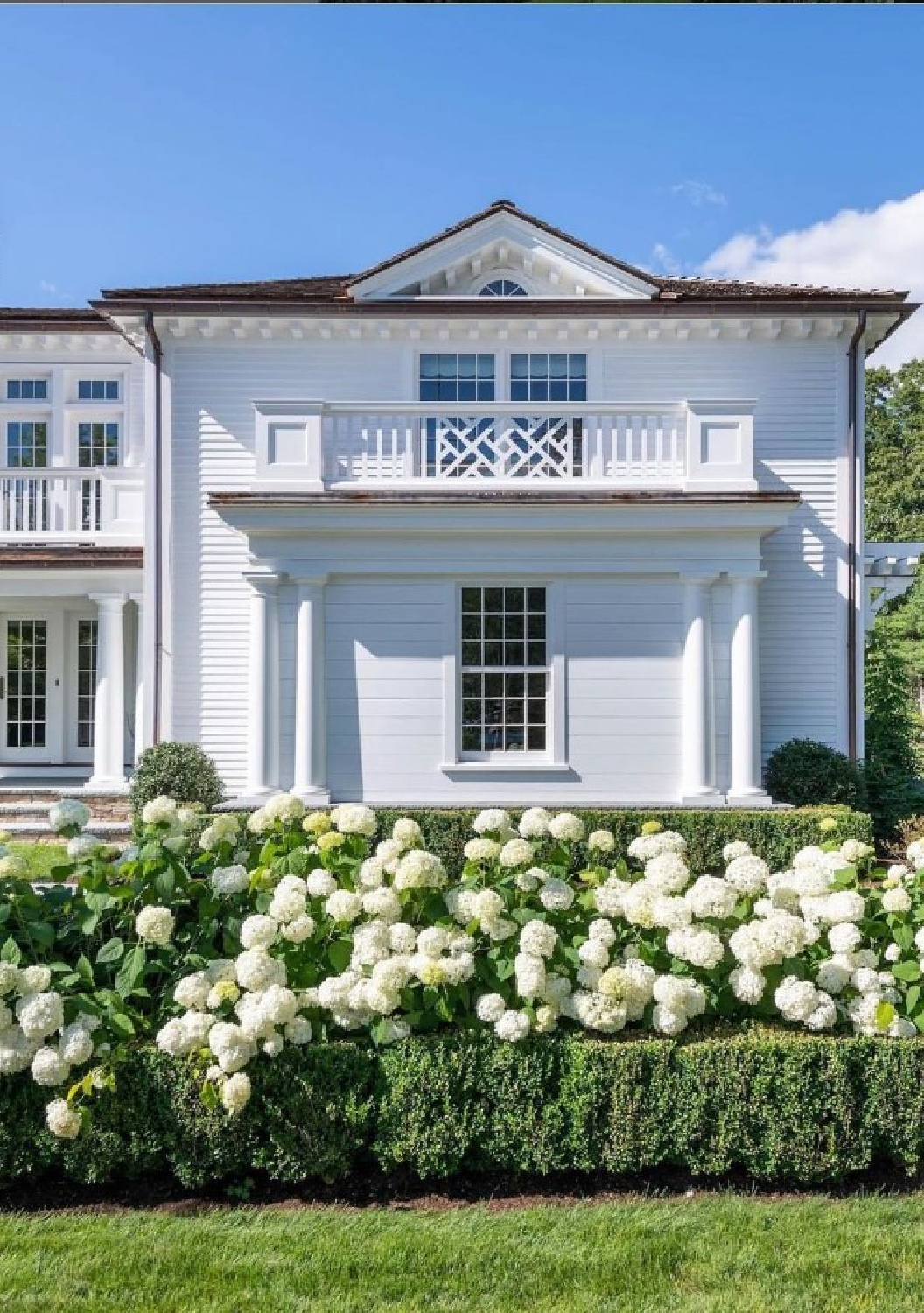 @rbaarchitecture - Beautiful white home exterior and hydrangea hedge. #classicarchitecture #whitehouses