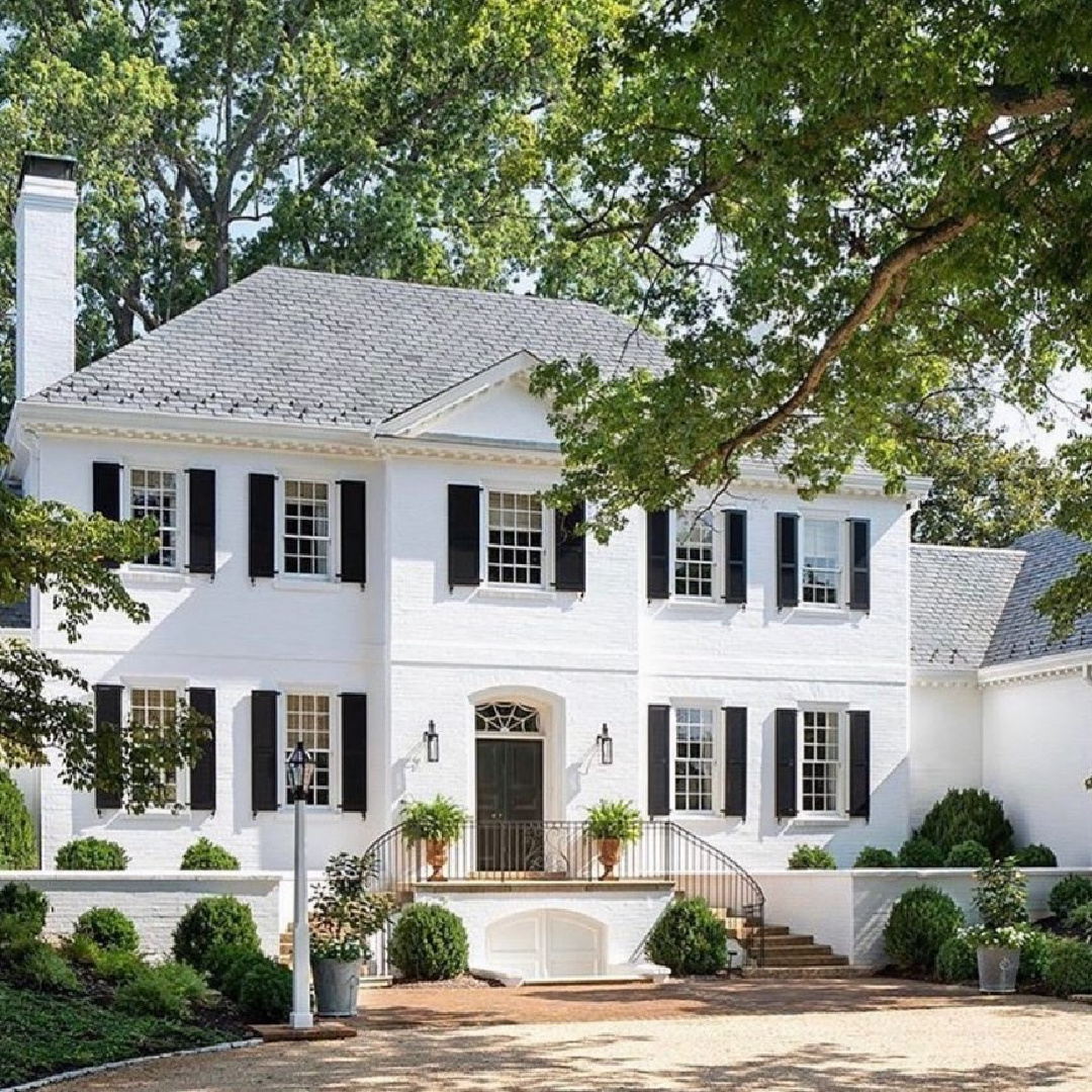 @dgparchitects - Beautiful white brick house exterior with black shutters. #classicarchitecture #whitehouses #whitehouseexteriors